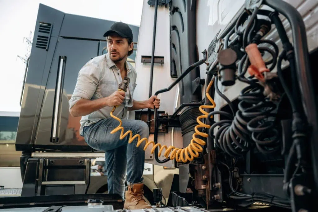 Closeup of a truck driver and a truck
