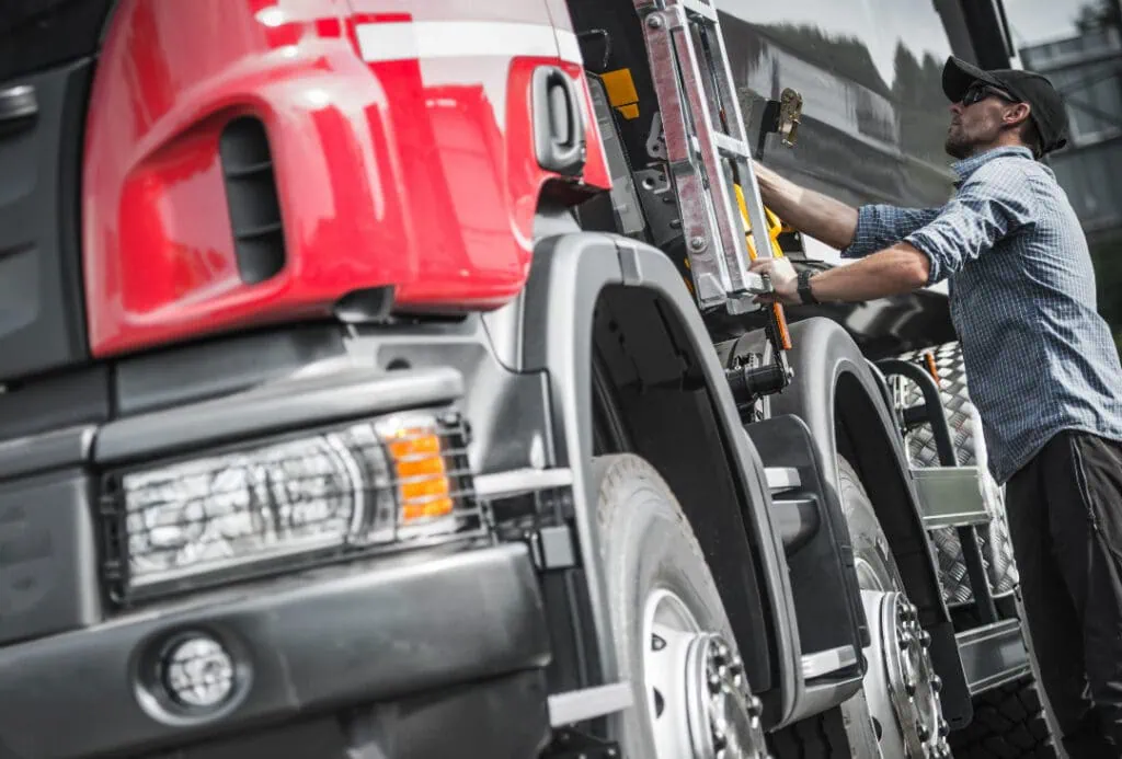 Closeup of a truck driver and a truck